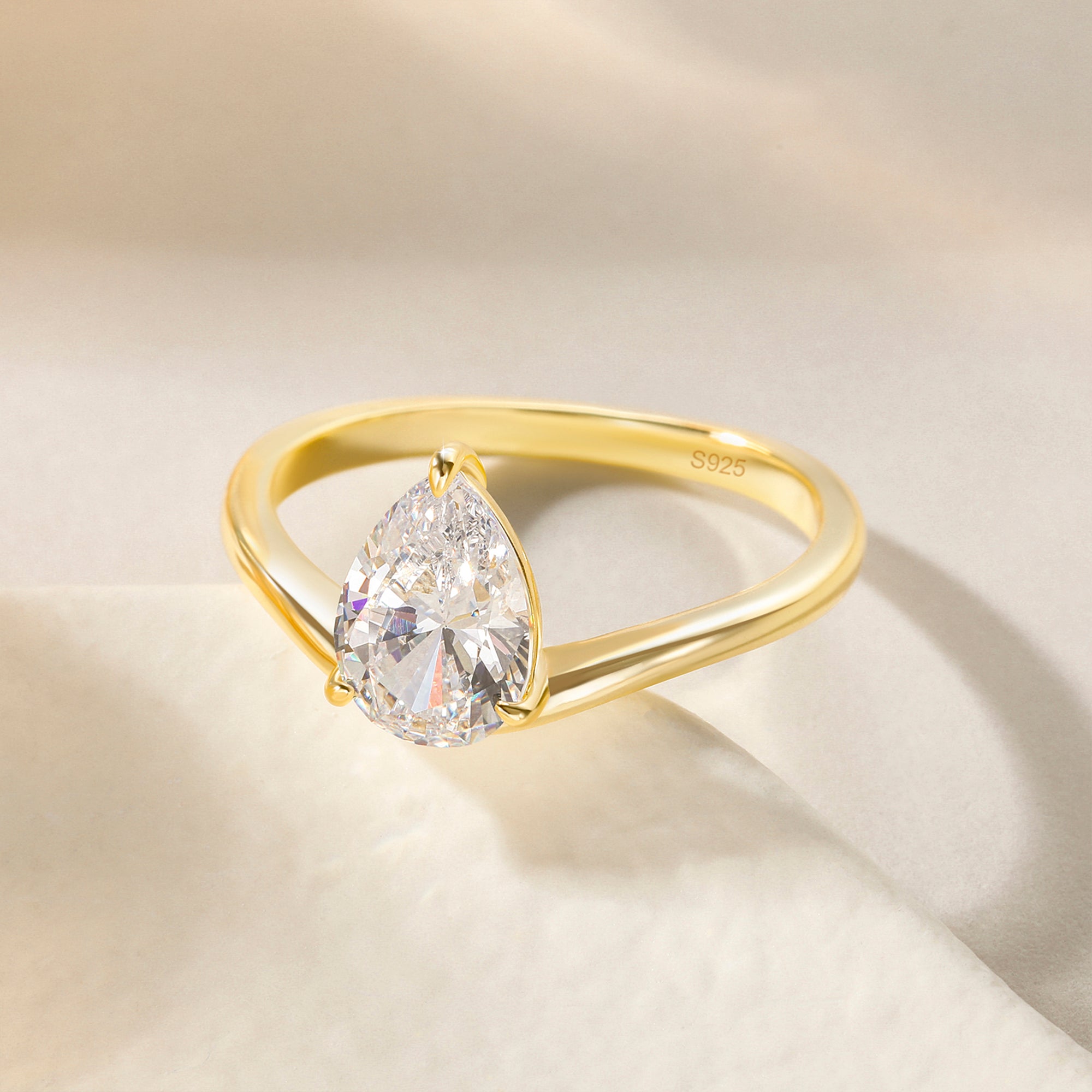 curved engagement rings, curved band, pear engagement rings, pear cut, cubic zirconia rings, cubic zirconia usa, travel rings, fake diamond rings, cz rings, affordable jewelry, gold engagement rings